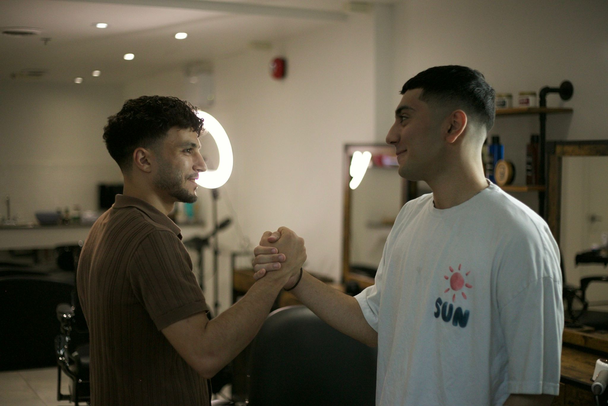 Barber and client at Kaz Barbershop