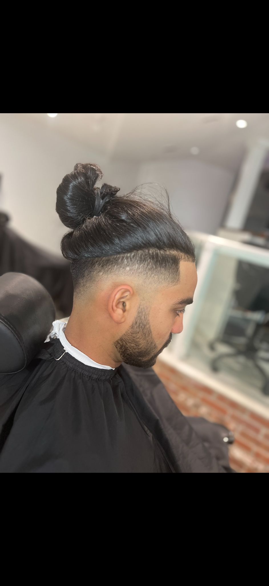 Topknot fade at Kaz Barbershop